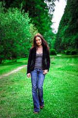 Portrait of young beautiful woman in park