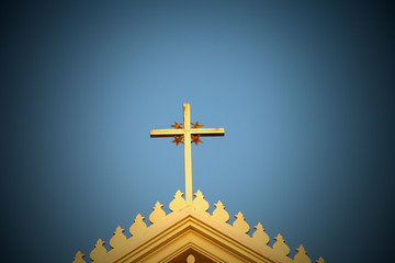 The cross on top of a blue background