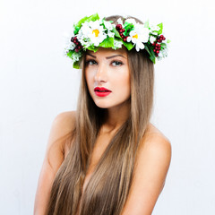 fashion model with  hairstyle and flowers in her hair