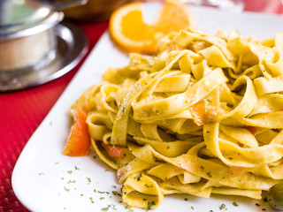 Pasta with pesto sauce and nuts