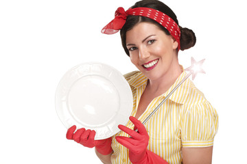 Young beautiful woman housewife showing a magic wand on dishes - 54088329