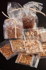 Cakes made with almonds peanuts pistachios on a blak background