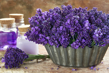Bouquet of purple lavenders and spa products