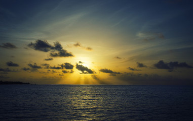sun goes over the ocean