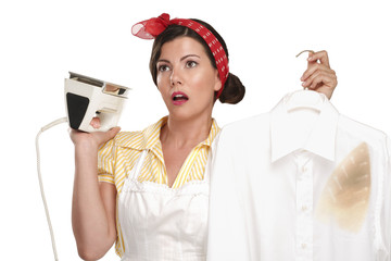 happy beautiful woman housewife ironing a shirt - 54091983