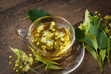 fresh linden tea on a wooden table