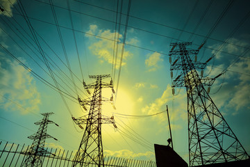 Transmission tower on Sun sky background