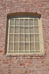 Old window in brick wall