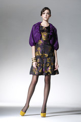 attractive young woman in elegant dress posing