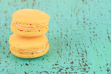 Macaroons on wooden table close-up