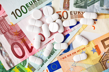 pills and euro banknotes