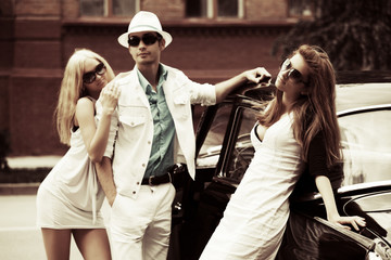 Young people at the retro car