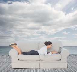 Businesswoman lying on couch