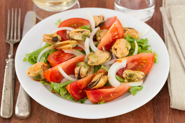 salad with mussels on the plate