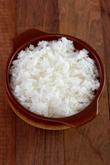 boiled rice in dark bowl