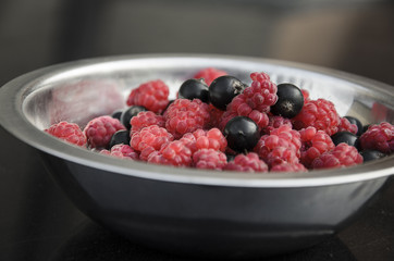 bowl of raspberries and black currants