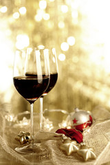 Two glasses of Red Wine and Christmas Ornaments