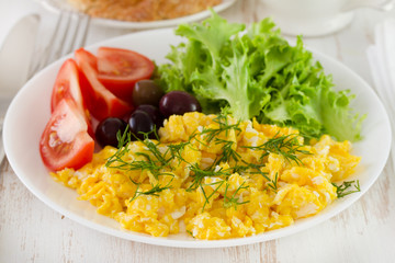 fried egg with salad on the plate