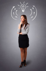 Pretty lady thinking with arrows and light bulb overhead