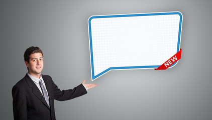 young man presenting modern speech bubble copy space