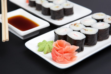 Set of japanese sushi on black