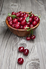 Fresh and tasty cherries on woden table