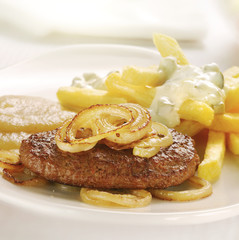 Grilled burger served with french fries and apple sauce