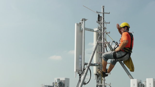 elevation worker resting after a on a base transceiver station a
