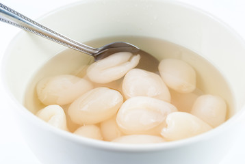 dessert rambutan in syrup on white background
