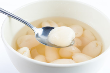 dessert rambutan in syrup on white background