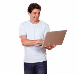 Attractive hispanic man working on laptop