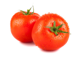 Pair of ripe red tomato with water drops