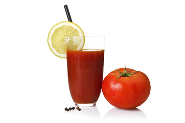 Glass with Tomato juice close up on white