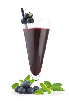 Blueberry juice with fruit sliced on white