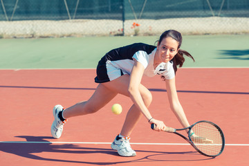 Young Woman Playing Tennis