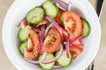 served plate with mix salad from tomatoes and cucumbers