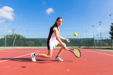 Young Woman Playing Tennis