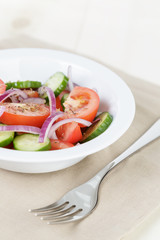 served plate with mix salad from tomatoes and cucumbers