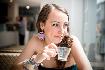 young beautiful woman drinking coffee