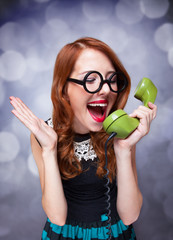 Redhead women with green telephone.