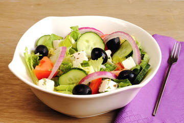 Greek salad with tomato, cucumber, onion, cheese and olives