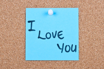 Post it note on wood