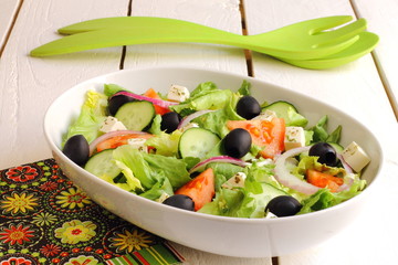 Greek salad with tomato, cucumber, onion, cheese and olives
