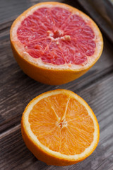 red grapefruit and orange on old table