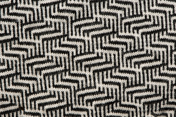 hand knit wool zigzag pattern black white backdrop