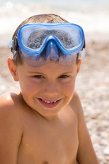 child having fun on the beach