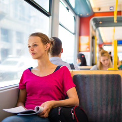 Pretty, young woman on a streetcar/tramway