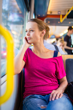 Pretty, young woman on a streetcar/tramway