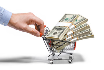 businessman's hand & steel grocery cart full of money stacks © Romario Ien