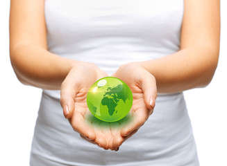 woman hands holding green sphere globe